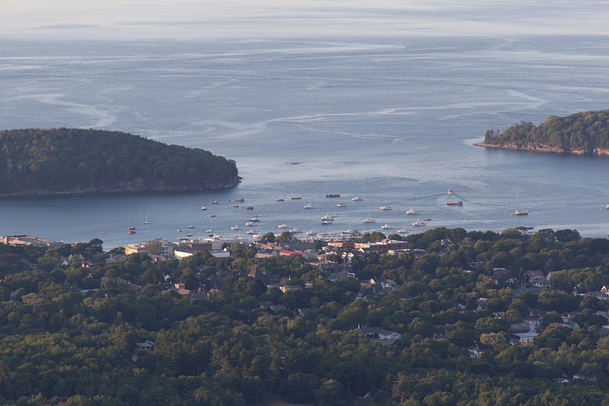 Aerial View of Coastal Town with Boats in Harbor