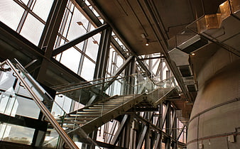 Low Angle View of Modern Industrial Staircase with Glass Railing