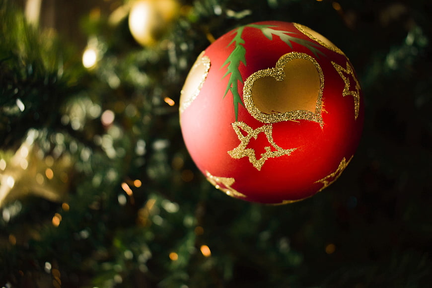 Red Christmas Ornament With Gold Heart Detail On Tree
