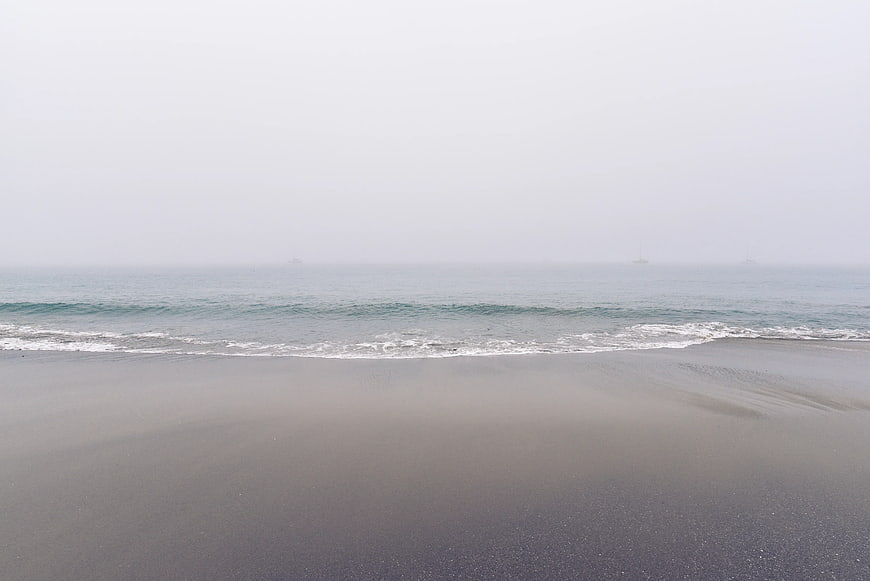 Foggy Beach Landscape with Gentle Ocean Waves