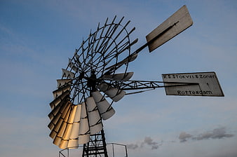 Vintage Windmill Pump Against Blue Sky