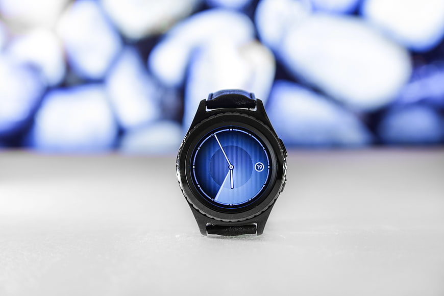 Black Smartwatch with Blue Dial on White Surface