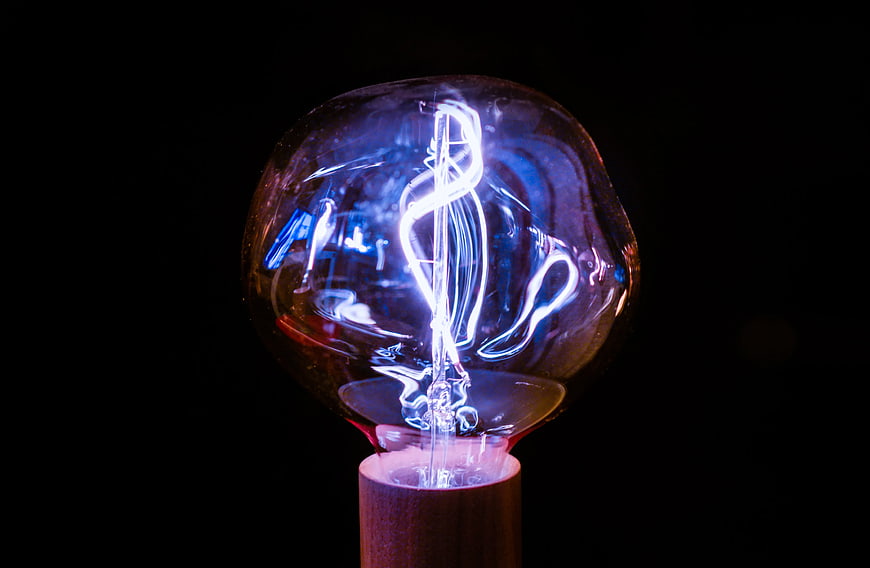 Illuminated Vintage Light Bulb with Blue Neon Glow