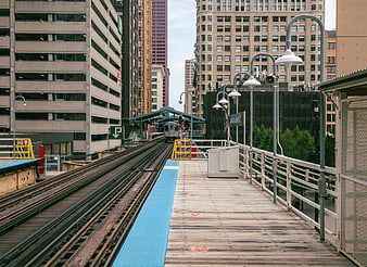 Empty Elevated Train Station Platform in Urban Cityscape