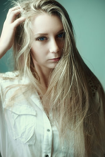 Blonde Woman Portrait With Blue Eyes And Long Hair