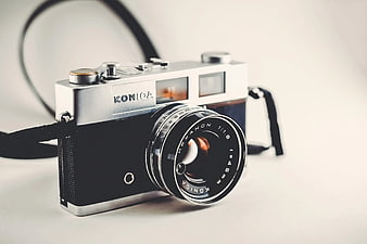 Vintage Konica Hexanon Film Camera on White Background