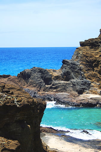 Rugged coastal cliffs overlooking turquoise ocean waters