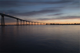 Long Exposure Bridge at Dusk Over Calm Water