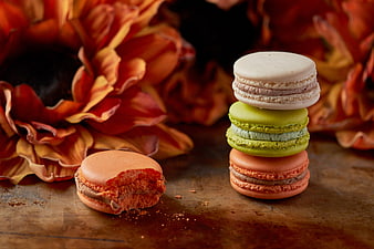 Stacked colorful macarons with autumn sunflower background