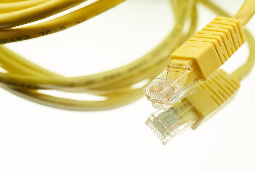 Yellow Ethernet Cable Close-Up on White Background