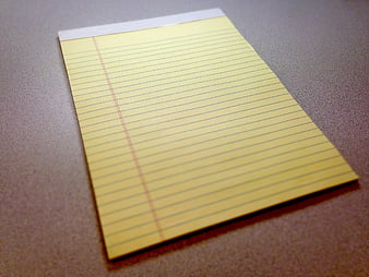 Blank Yellow Legal Pad On Gray Desk Surface