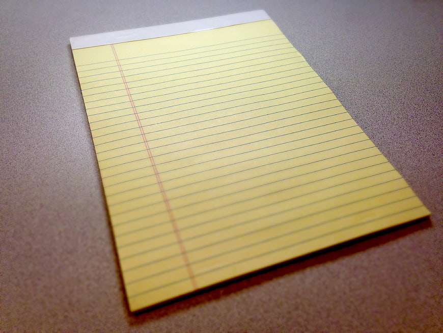Blank Yellow Legal Pad On Gray Desk Surface