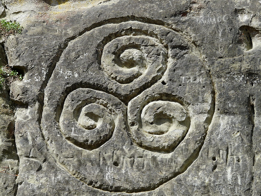 Ancient Triskele Spiral Carved in Weathered Stone Rock