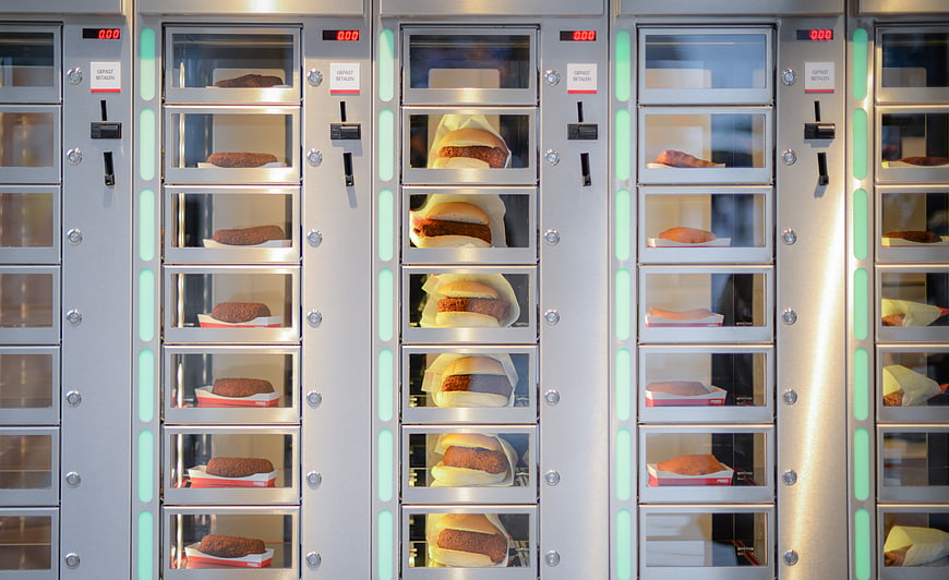 Vending machine filled with burgers and fried food