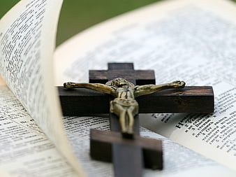 Wooden Crucifix on Open Bible Pages