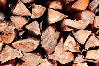 Close-up texture of stacked firewood logs