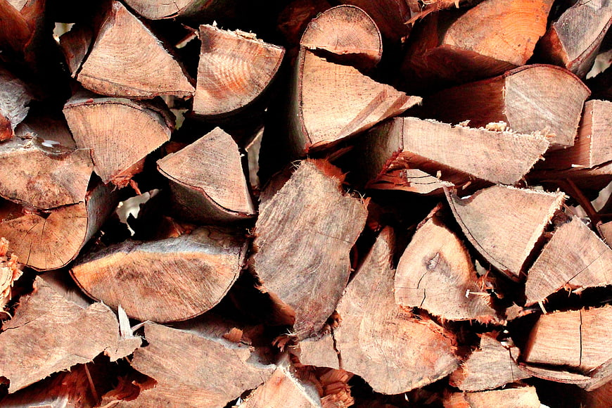Close-up texture of stacked firewood logs