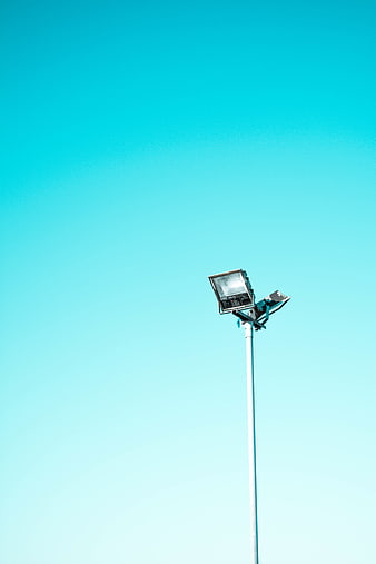 Solar street light against clear blue sky