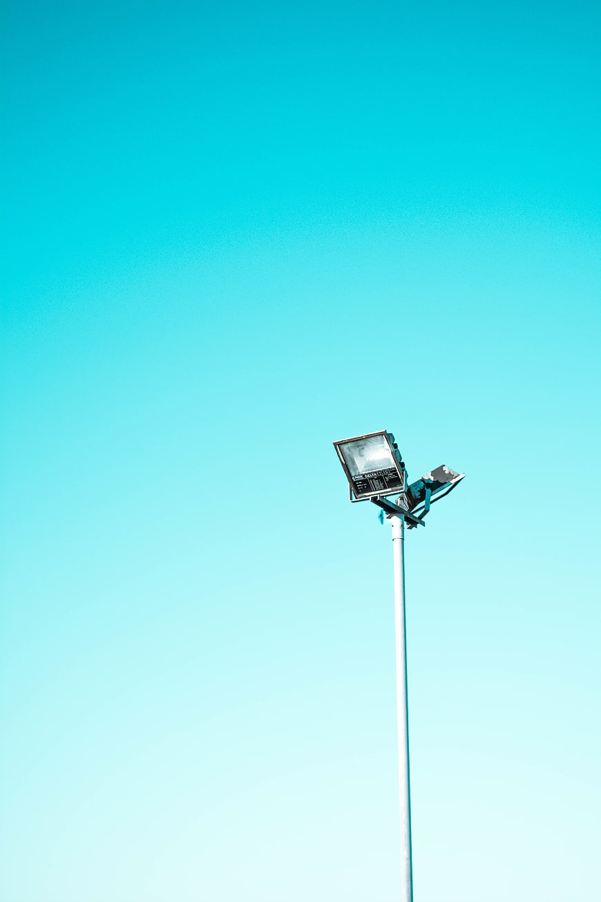 Solar street light against clear blue sky