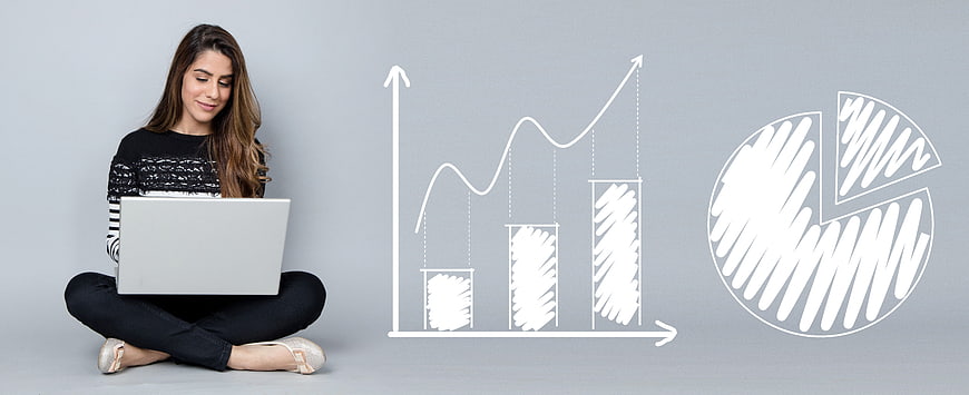 Woman with laptop and hand-drawn business growth charts