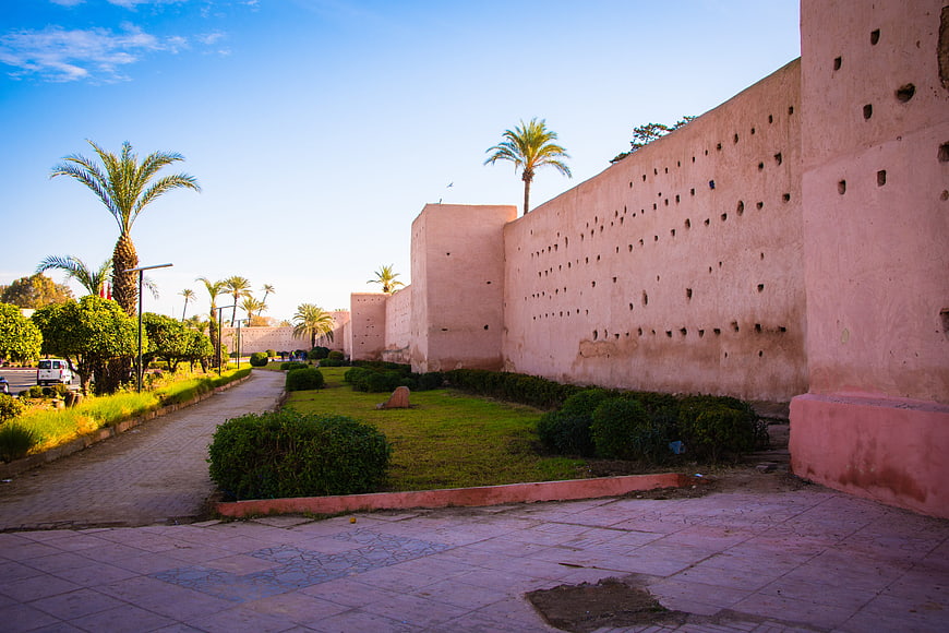 Pink Kasbah Walls and Palm Trees in Marrakech, Morocco