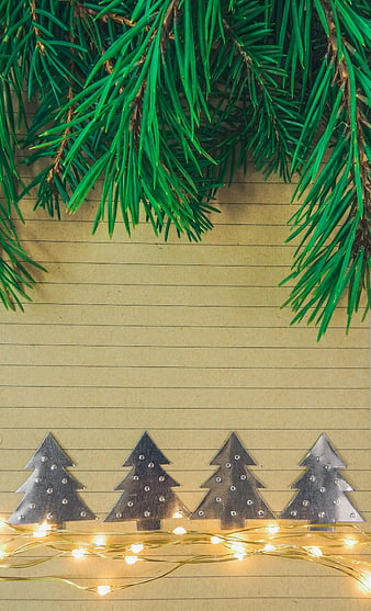 Christmas flat lay with pine branches and metal trees