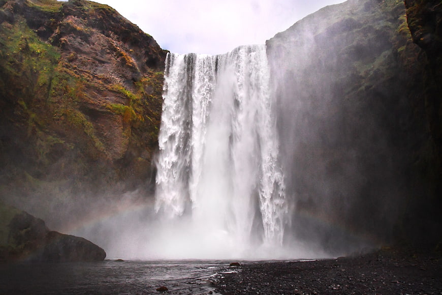 Majestic Skógafoss Waterfall in Iceland with Mist and Rainbow