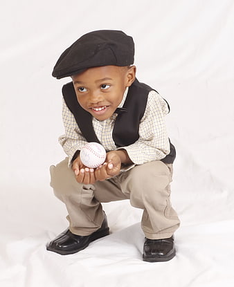Cute African American Boy in Vintage Outfit Holding Baseball