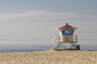 Lone Lifeguard Tower on Sandy Beach with Ocean View