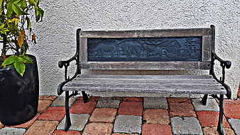 Rustic Wooden Bench with Farm Animal Relief on Patio
