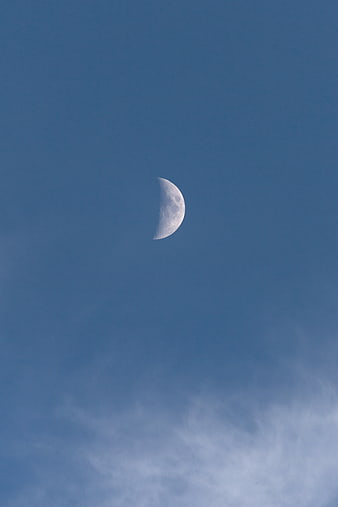 Crescent Moon in Blue Sky with Wispy Clouds
