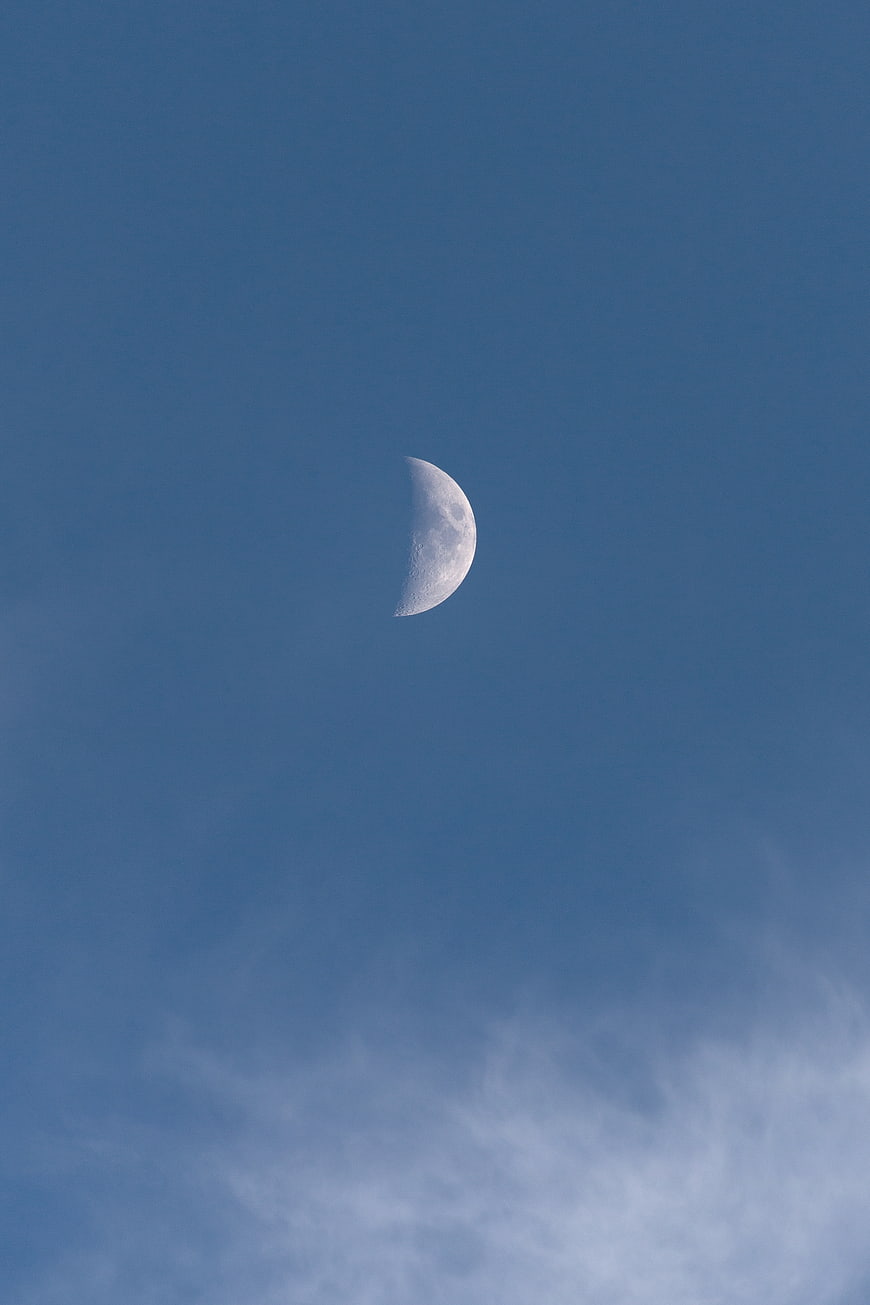 Crescent Moon in Blue Sky with Wispy Clouds