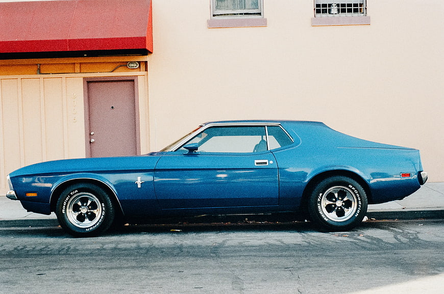 Side Profile of Classic Blue Ford Mustang Mach 1
