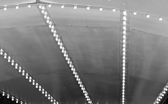 Abstract black and white ceiling with geometric light patterns