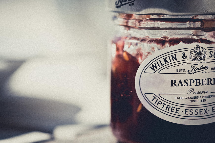 Close-up of Tiptree Raspberry Preserve Jar