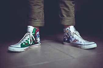 Custom hand-painted high-top sneakers with pop art designs