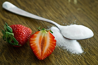 Fresh Strawberries and Spoon of Sugar on Wooden Table