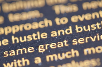 Close-up of Gold Foil Text on Black Background