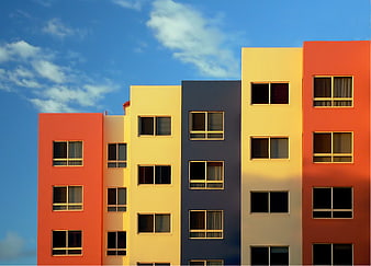 Colorful Modern Apartment Buildings Against Blue Sky
