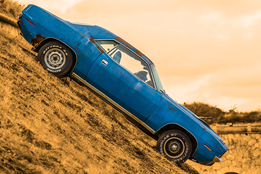Vintage Blue Plymouth Barracuda on Grassy Hill