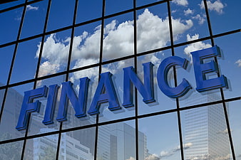 Blue Finance Sign on Glass Building Facade