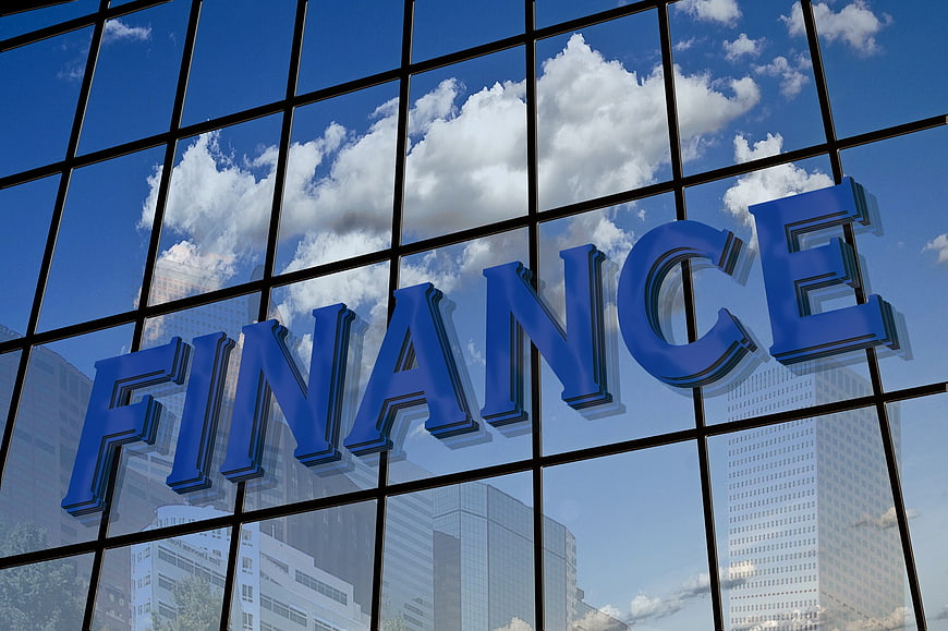 Blue Finance Sign on Glass Building Facade