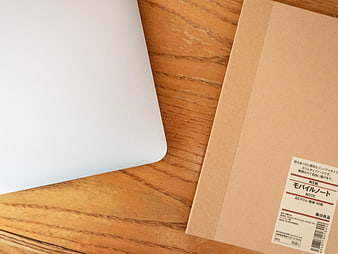 Minimalist Laptop and Notebook on Wooden Desk