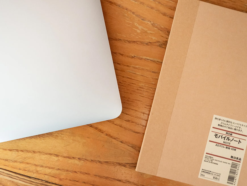 Minimalist Laptop and Notebook on Wooden Desk