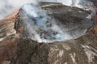 Aerial View of Active Volcanic Crater with Smoke and Lava
