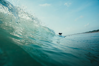 Surfer Riding a Wave from Water Level Perspective