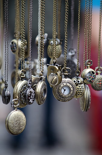 Vintage Brass Pocket Watches Hanging on Chains