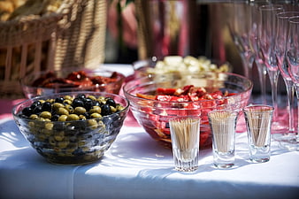 Catering buffet table with olives, peppers, and toothpicks
