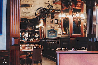 Vintage pub interior with bicycle hanging from ceiling
