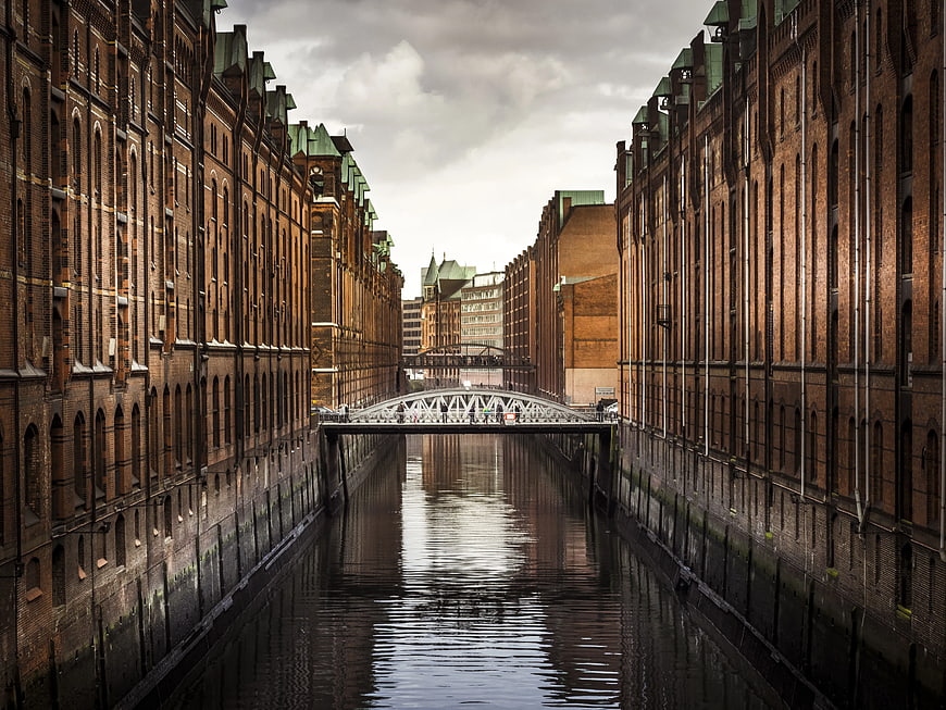 Symmetrical View of Speicherstadt Canal and White Bridge